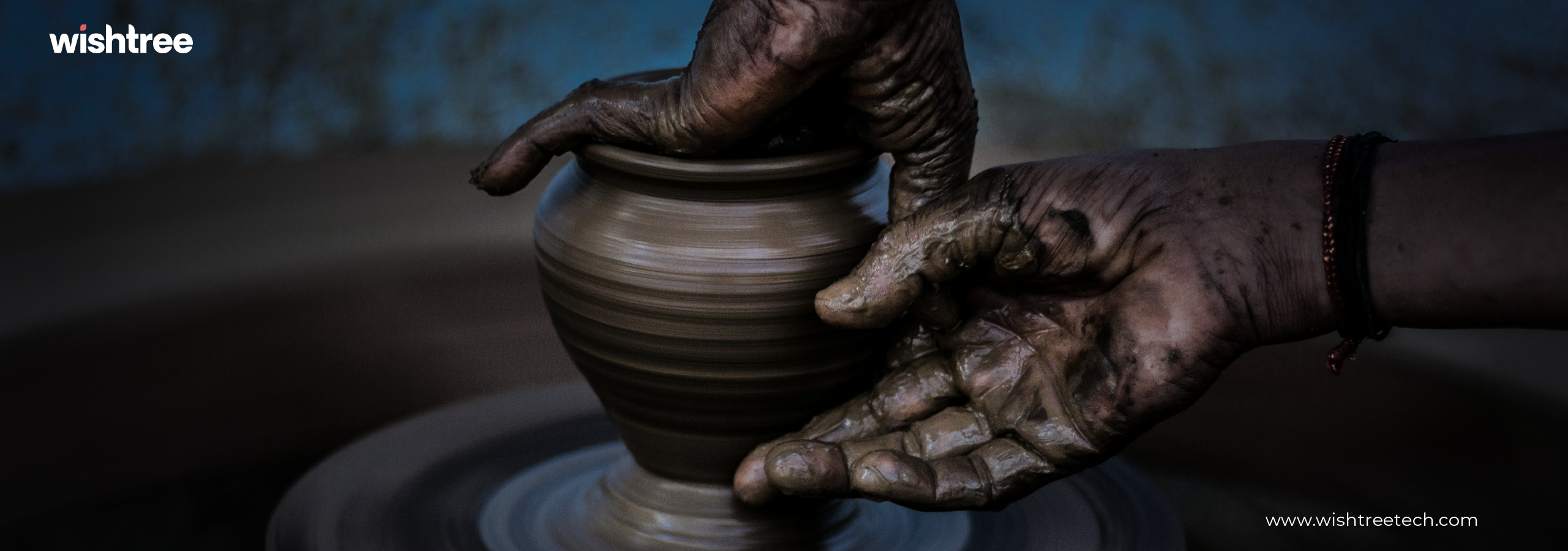 Potter reshaping a clay pot on a wheel, demonstrating traditional pottery-making techniques.